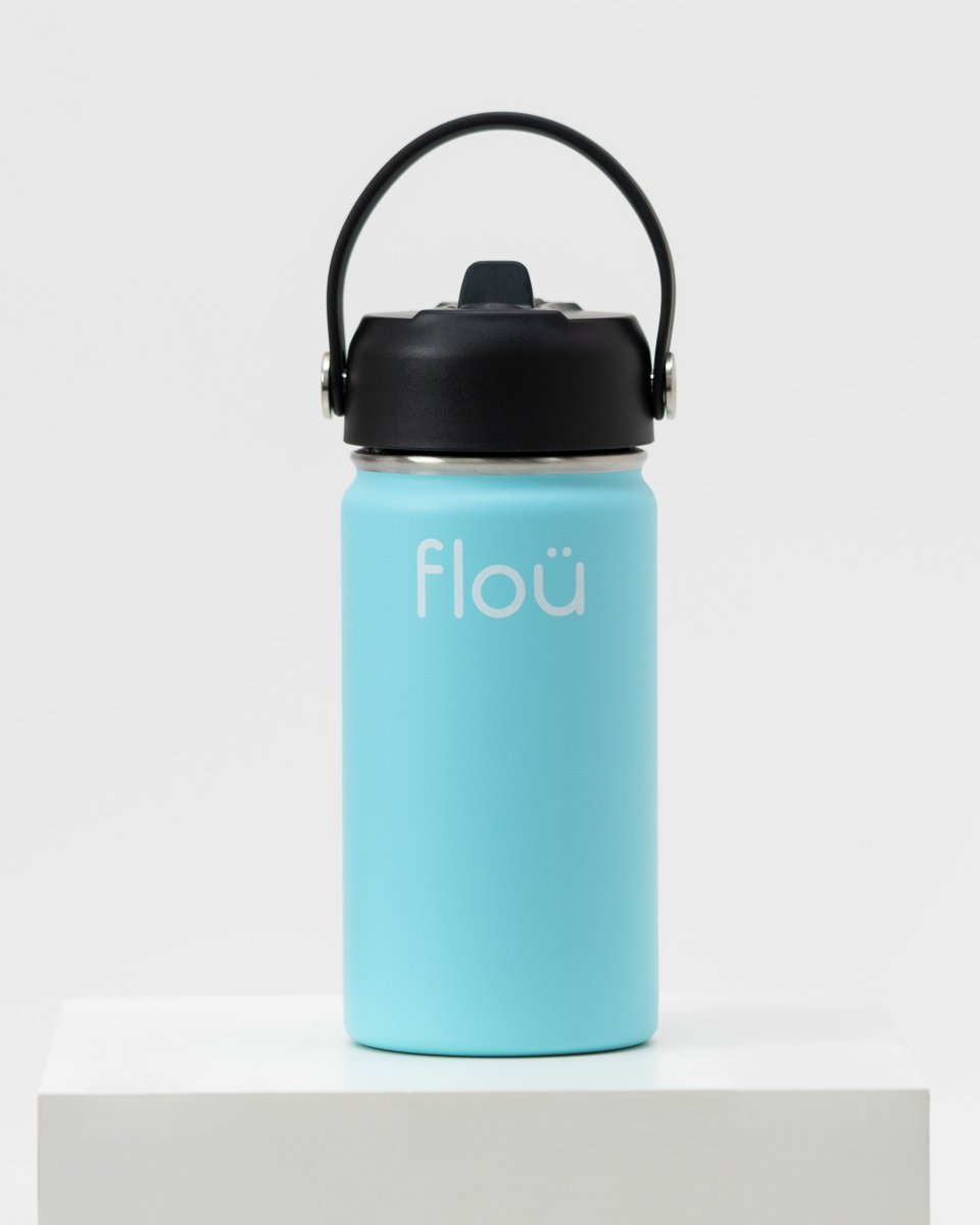 Light blue insulated water bottle for kids with handle lid and straw.