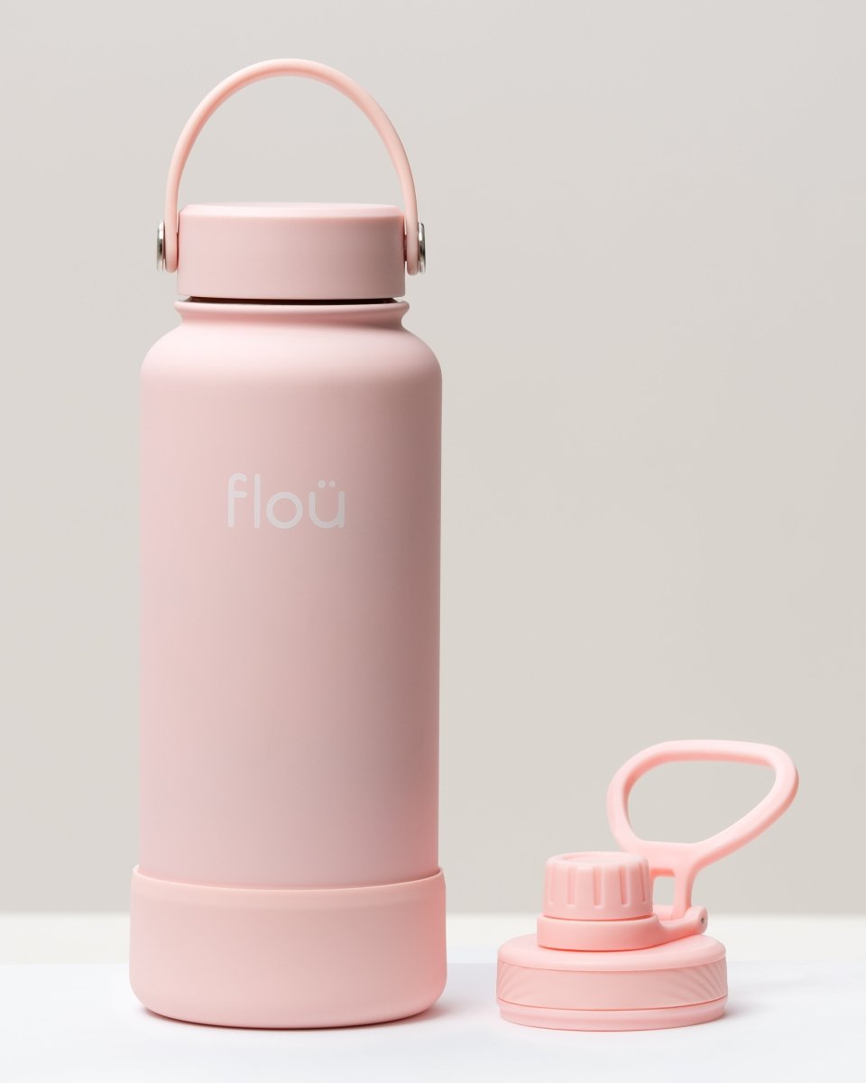 32 oz Baby pink double wall insulated water bottle with 2 lids.